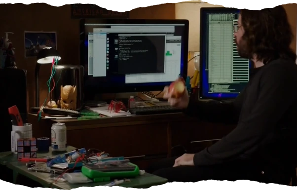 Gilfoyle from the TV Series Silicon Valley in a messy ugly room, staring at a dark terminal
